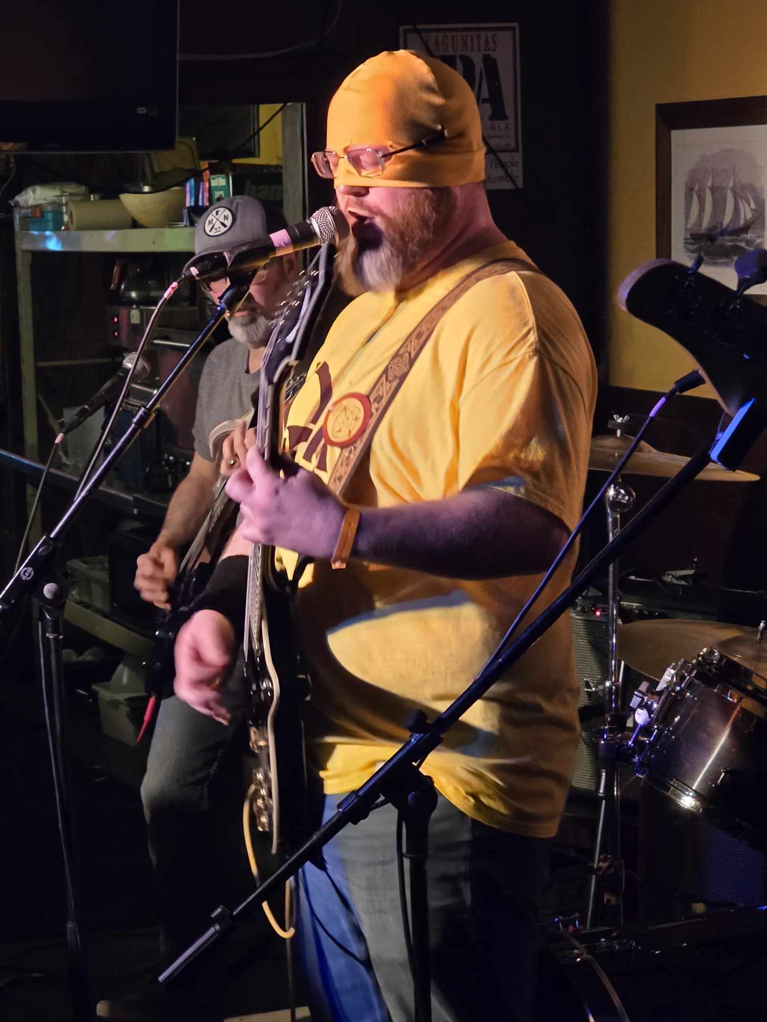 Joel dressed up as Discord at Dawn's mascot, playing his guitar, and singing for a homegrown show.  You can see Andy with his guitar in the background.